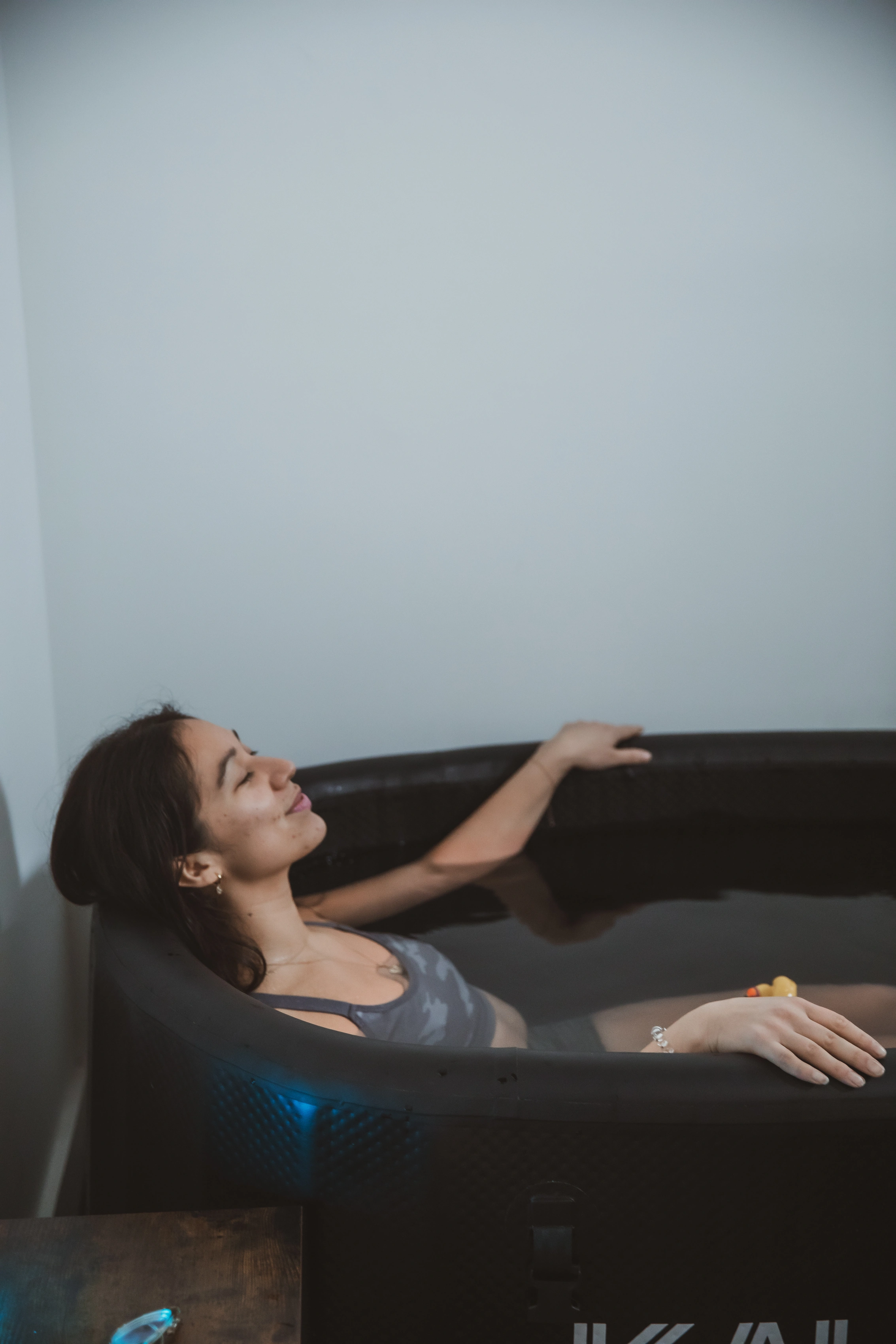Member relaxing in the cold plunge at Move Detroit