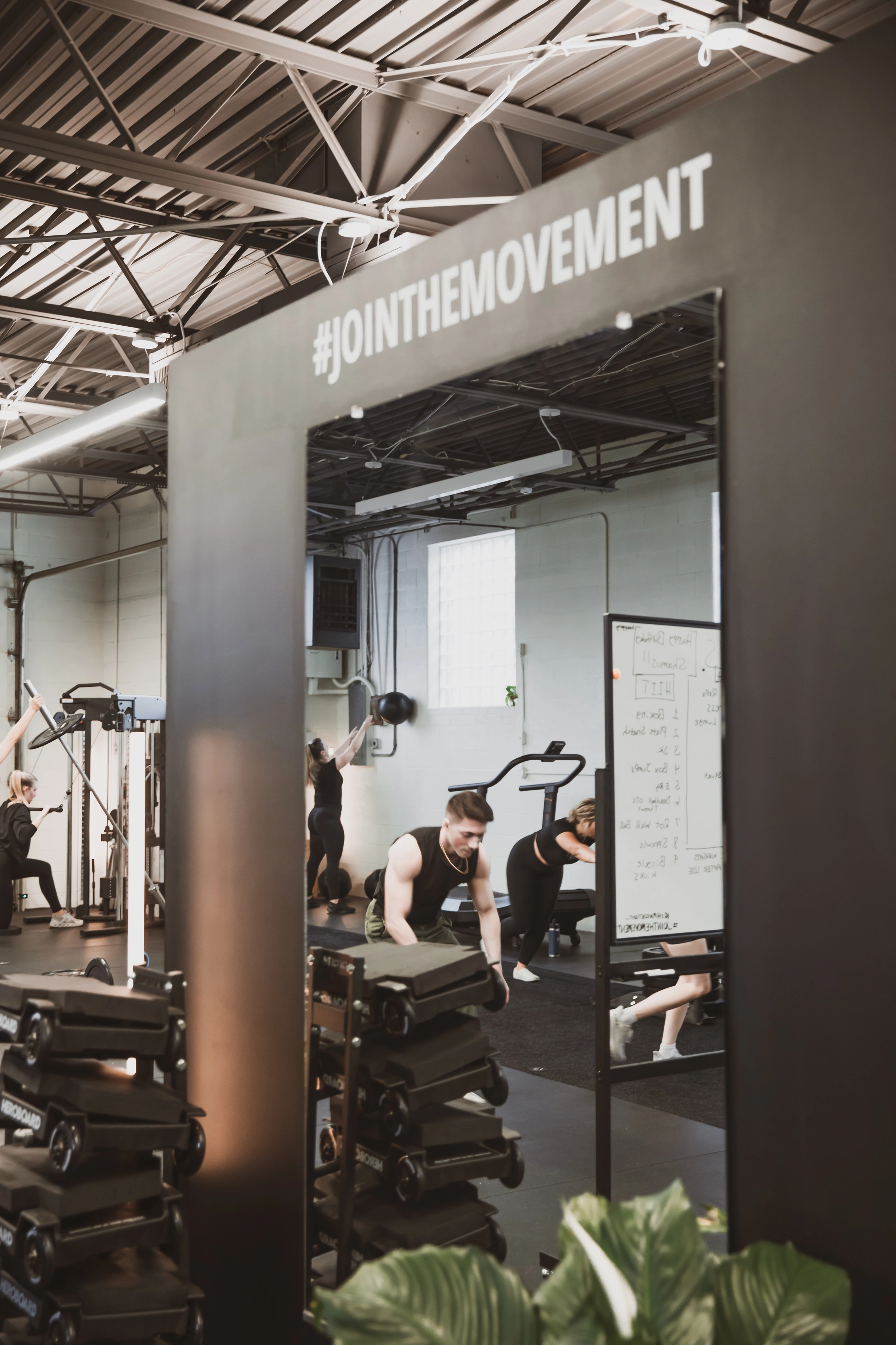 The #JOINTHEMOVEMENT mirror and training floor at Move Detroit