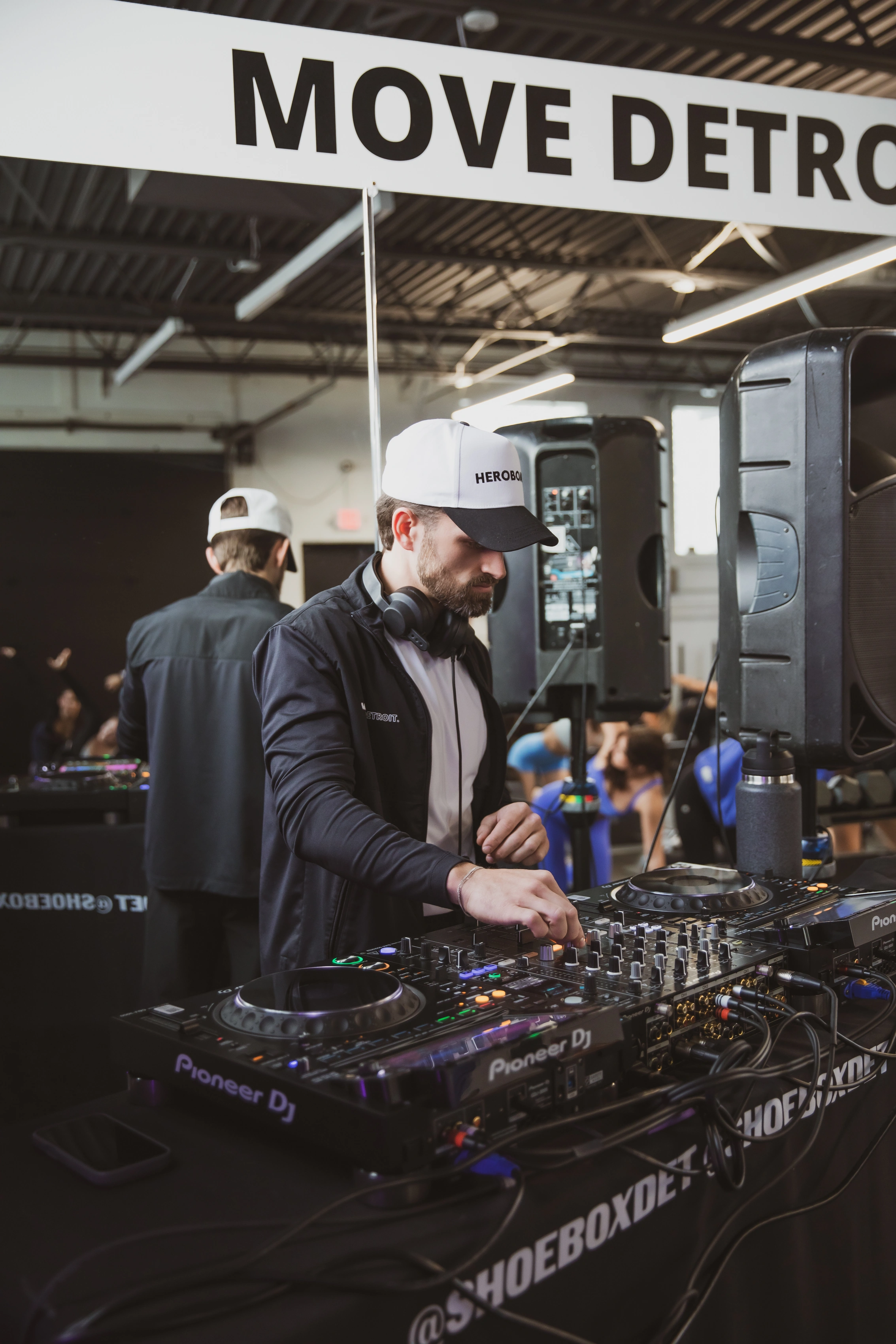 DJ mixing beside the training floor